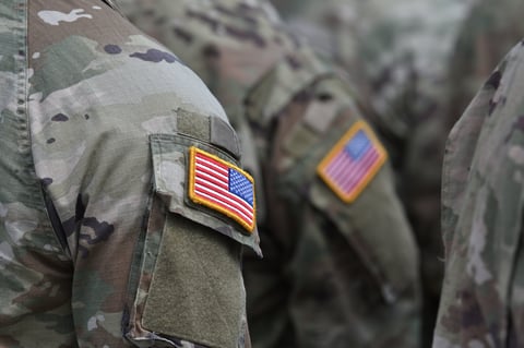 Person wearing military clothes with national symbol